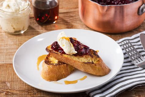 Baguette French Toast With Homemade Berry Sauce Topped With Whipped