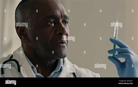 Professional Mature African Doctor Ethnic Man Surgeon Nurse Scientist Anesthesiologist Testing
