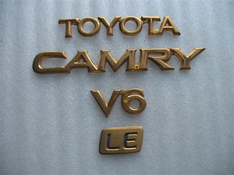 Sell Toyota Camry V Le Rear Trunk Gold Emblem Logo Decal Used Set