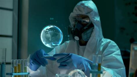 Premium Photo Scientist In Ppe Suit With Planet Hologram Working In