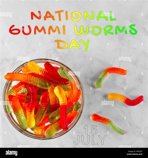 Gummi Worms On White Marble Background With Text National Gummi Worm