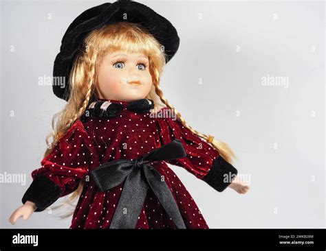 Vintage Austrian Porcelain Doll Girl With Blue Eyes Blonde With Braids Wearing A Dark Red