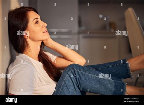 Cute Brunette Female Being Deep In Her Thoughts Stock Photo Alamy