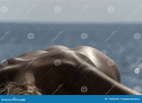 Naked Girl Lies On The Beach Beautiful Body Bends Back Booty Tanned Skin Stock Image Image