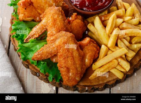 Fried chicken wings with sauce and French fries Stock Photo: 78208248