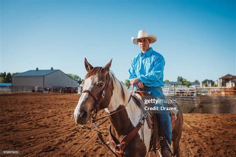 cowboy riding horse   ranch  usa high res stock photo getty images