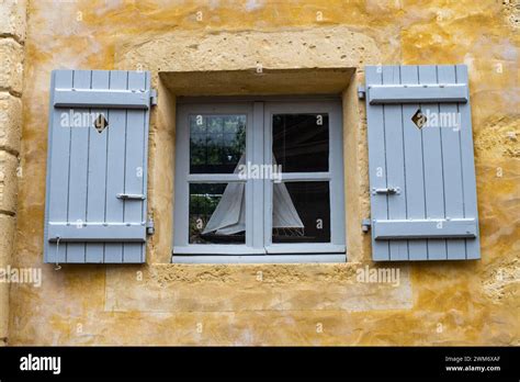 Two Open Blue Shuttered Windows With Sailing Boat Silhouette Stock