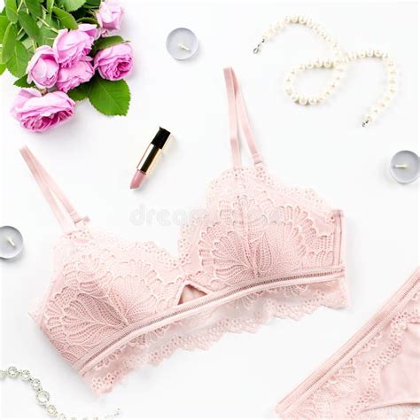 Woman Elegant Pink Lace Bra And Panties Flowers Jewelry Stylish Lingerie Flat Lay Stock Photo