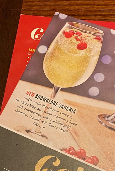 Two Magazines On Top Of Each Other With Drinks In Them