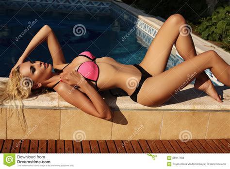 Blond Woman In Bikini Relaxing Beside A Swiming Pool Stock Image Image Of Sensual Hair 55947183