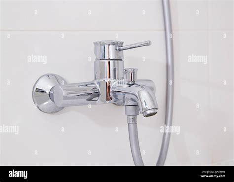 Modern Silver Chrome Bathroom Faucet With Hot And Cold Water On A White Wall Stock Photo Alamy