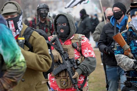 Armed protesters gather at Michigan state capitol