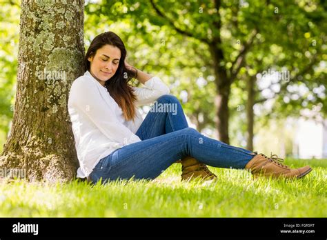 Beautiful Brunette Relaxing In The Park Stock Photo Alamy
