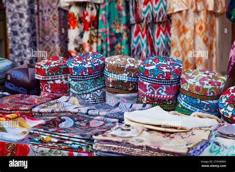 Uzbek traditional clothes such as skullcaps and other colorful ...