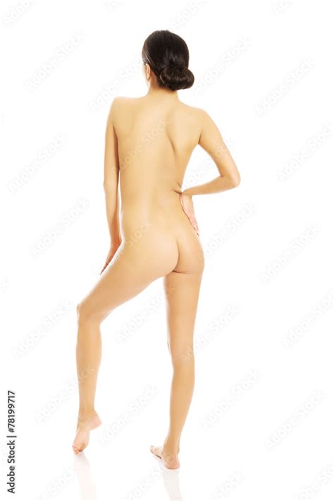 Back View Nude Woman Standing Touching Her Back Stock Photo Adobe Stock