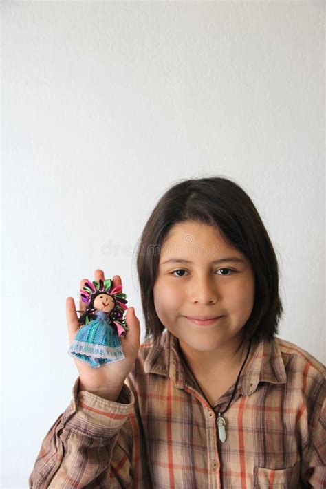 Year Old Hispanic Latina Girl Shows Her Favorite Toy And Dessert In The Form Of A Traditional
