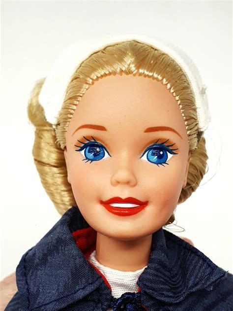 Barbie Doll With Blonde Hair And Blue Eyes