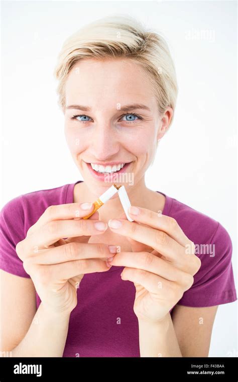 Pretty Blonde Breaking Cigarette Stock Photo Alamy