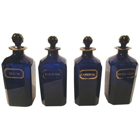 1stdibs Set Of 4 Bristol Blue Glass Decanters With Original Glass Stoppers Explore Items From