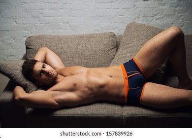 Naked Male Model Lying On Sofa Stock Photo Edit Now