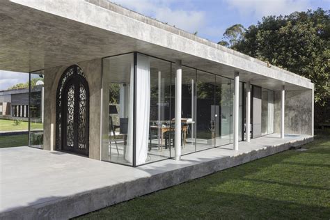 Striking Concrete And Glass Home Has A Twist Curbed