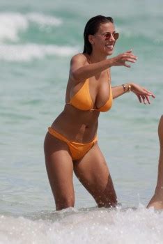 Devin Brugman Showing Off Her Awesome Curves In A Tiny Orange Bikini On Miami Beach July 12