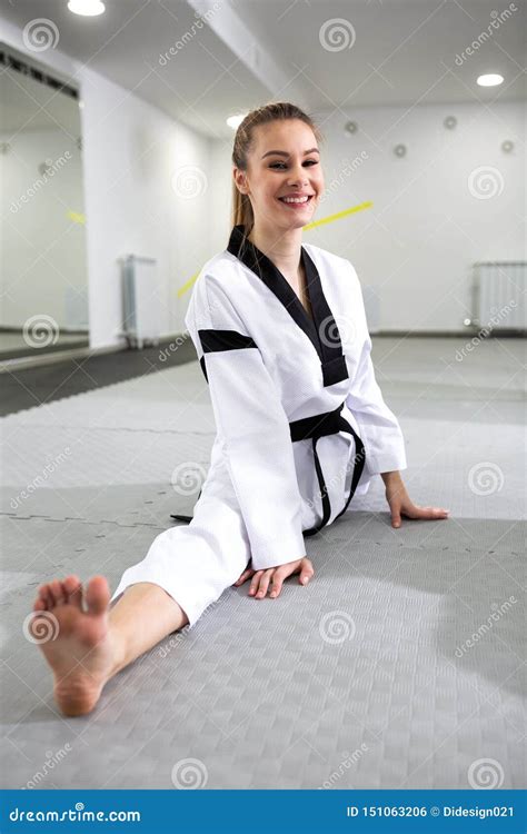 Pretty Girl Showing Devotion To Martial Art Of Taekwondo Stock Photo