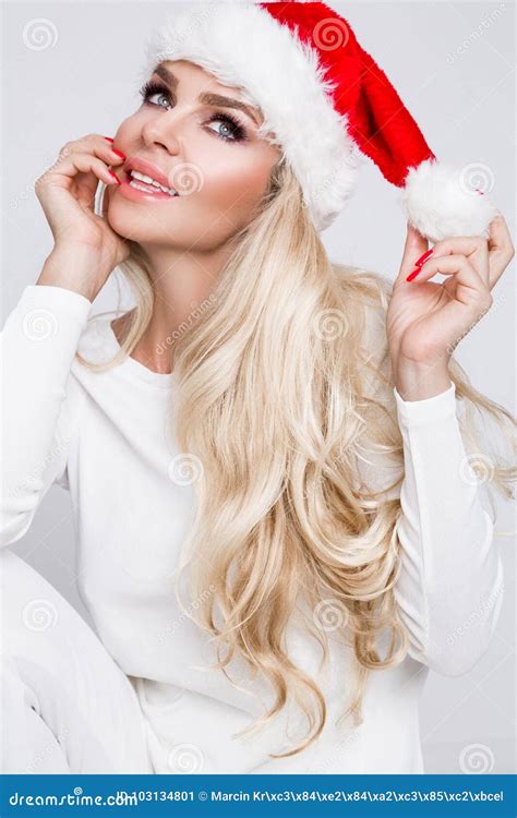 Beautiful Blonde Female Model Dressed As Santa Claus In A Red Cap Stock Image Image Of Clothes
