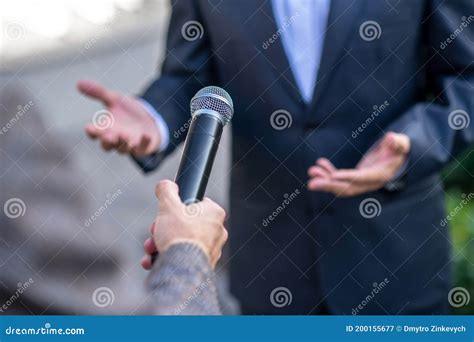 Close-up of Male Hands Holding Microphone during Interview Stock Image ...