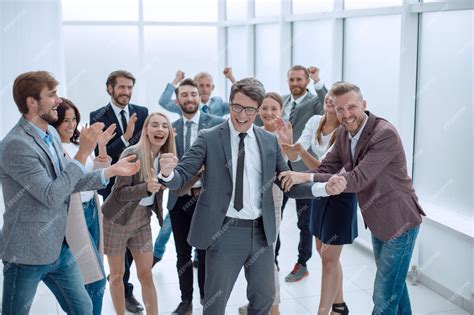 Premium Photo Triumphant Business Team Congratulating Their Leader