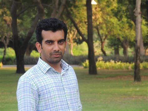 premium photo portrait  young man standing  grassy field