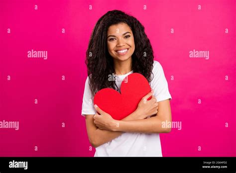 Photo Of Nice Brunette Millennial Lady Hug Heart Wear White T Shirt Isolated On Pink Color