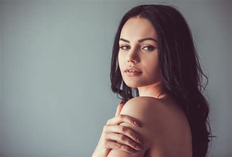 Premium Photo Brunette With Bare Shoulders Looking Sensually At Camera