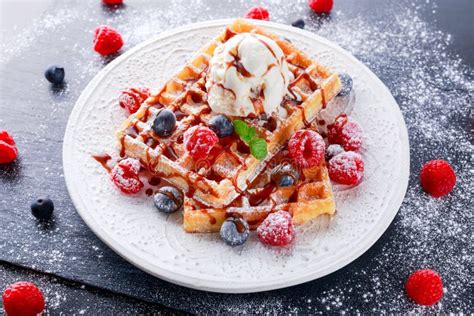 Belgian Waffles With Ice Cream Chocolate Sauce And Fresh Berries