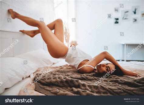 Beautiful Sexy Brunette Woman Lingerie Lying Stock Photo
