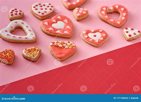 Decorated Heart Shape Cookies On A Colored Red And Pink Background Top