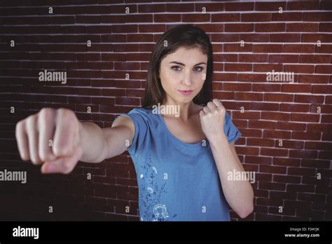 Pretty Brunette Punching To Camera Stock Photo Alamy