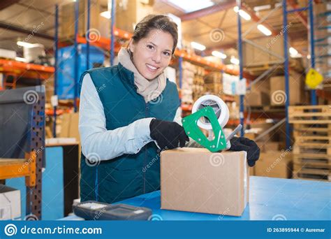 Female Worker Packing Box In Warehouse Stock Photo Image Of Shelves