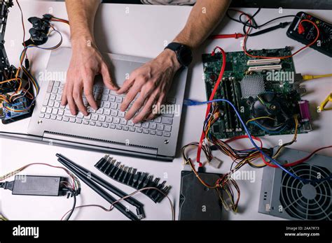 Electronics Technician Working Testing And Configuring Computer