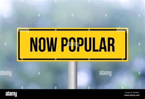 Now Popular Road Sign On Blur Background Stock Photo Alamy