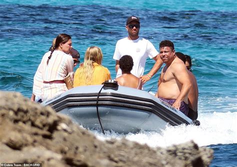 Shirtless Ronaldo Nazário packs on the PDA with his bikini clad model girlfriend Celina Locks