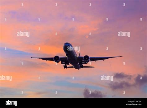 Plane Landing During Sunset At London Heathrow Airport Stock Photo Alamy