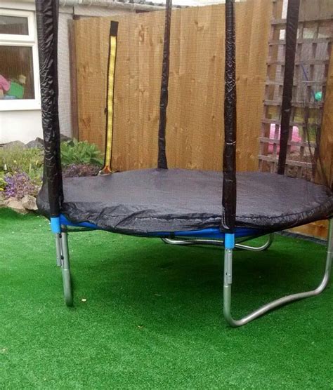 Putting Some Artificial Grass Under The Trampoline Makes The Garden