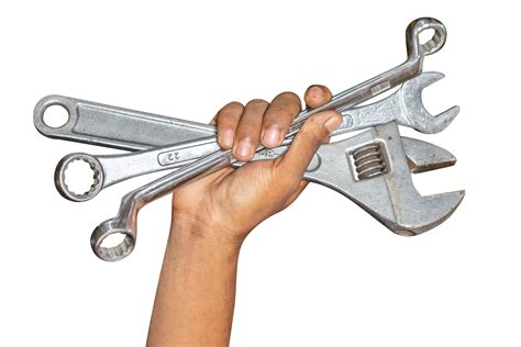 Hand Of Car Mechanic With A Wrench Isolated Over Transparent