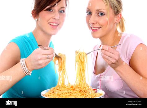 Young Women Eating Spaghetti Model Released Stock Photo Alamy