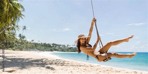 Bikini Beach Girl Model In Black Swimsuit On Palm Tree Swing On Stock Photo Adobe Stock