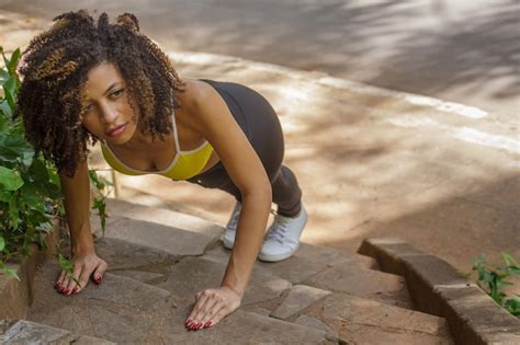 Premium Photo An Energetic Brunette Woman Conquering Her Outdoor Exercise Routine