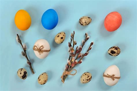 Premium Photo Happy Easter Easter Composition Of Eggs And Pussy Willow Branches On A Blue