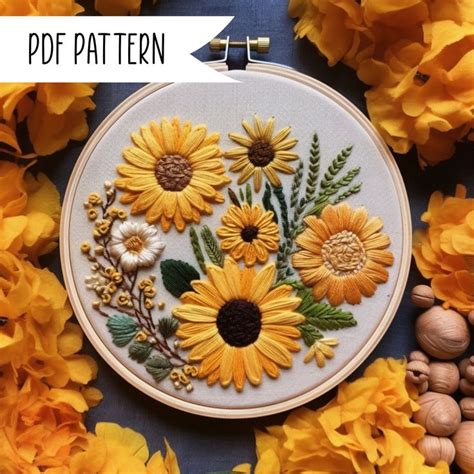 An Embroidery Pattern With Sunflowers And Leaves On The Hoop Surrounded