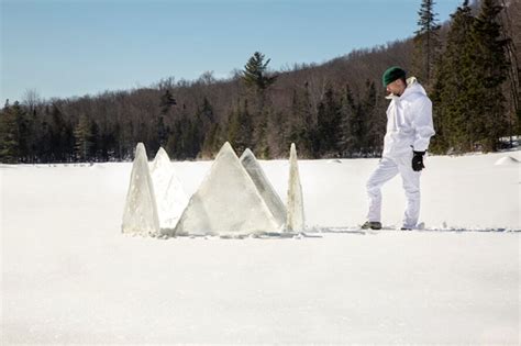 Designers build a frozen igloo shelter in a geodesic dome shape